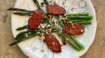 OVEN BAKED ASPARAGUS WITH CHORIZO PINE NUTS AND PARMESAN -